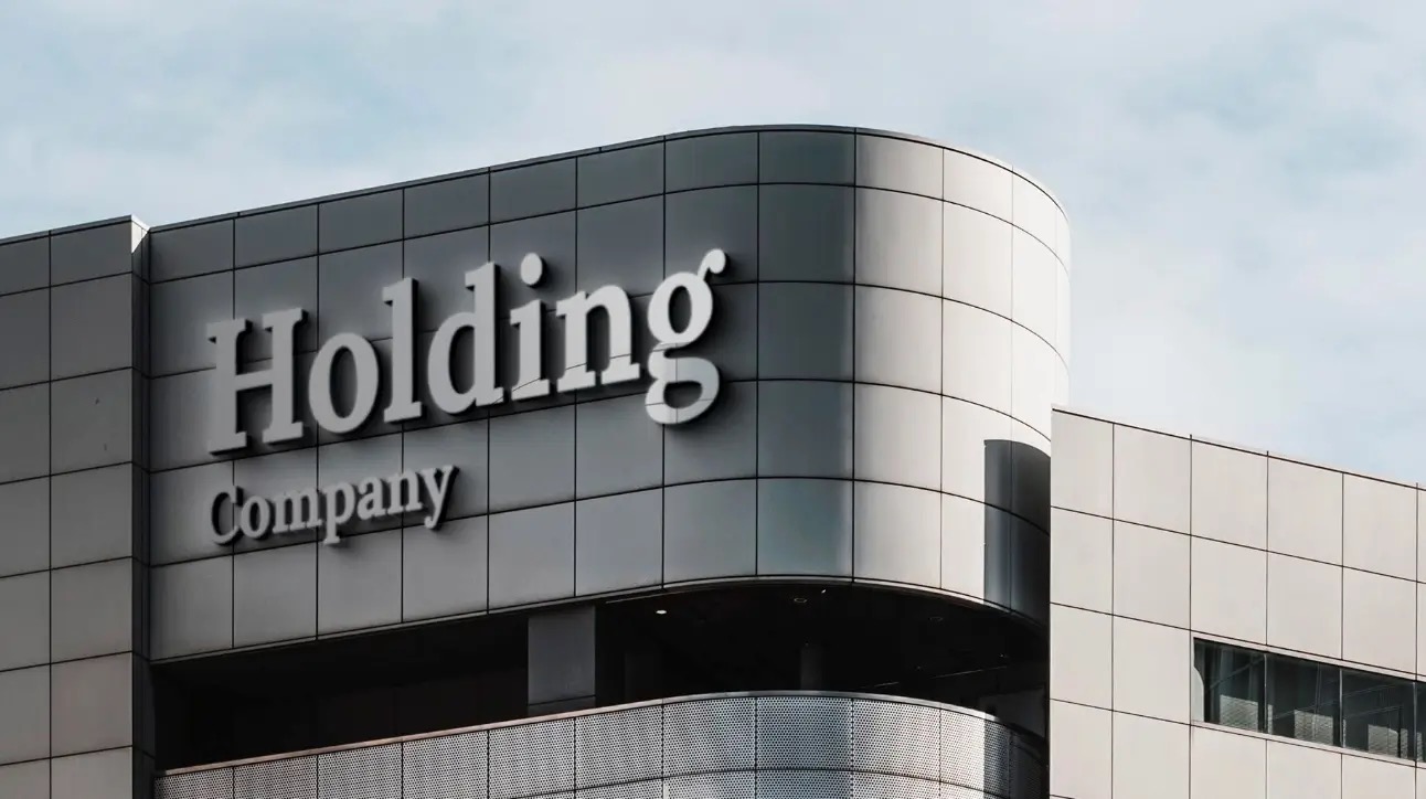Hillman Ventures holding company architecture. Modern corporate building with Holding Company signage.