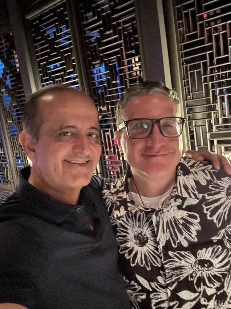 Andrew Hillman with Dr. Raj, chief investigator, in Miami Beach, Florida