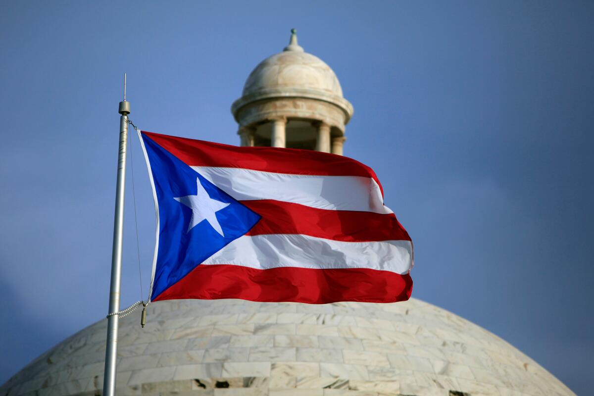 Puerto Rico capitol with Puerto Rican flag